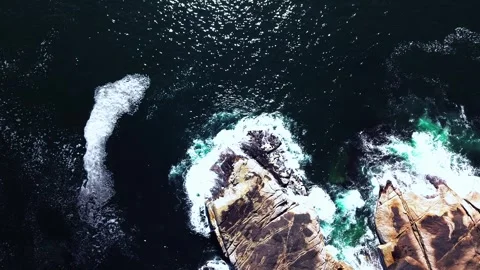 Overhead aerial of waves and rocks, cinematic moody grade Stock Footage 339187010