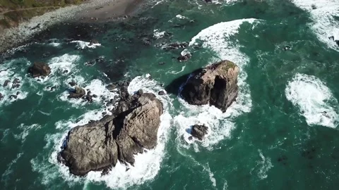 Overhead Aerial of Waves Crashing on Rocks in Ocean Stock Footage 149017828