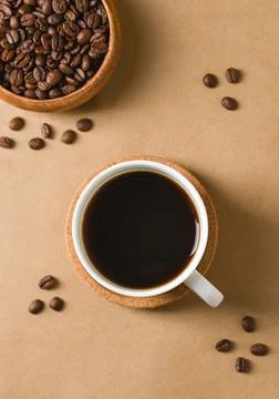 Overhead Arabica filter coffee with roasted beans on brown background Stock Photos