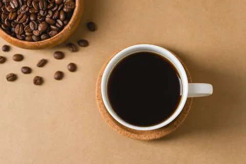 Overhead black coffee composition with roasted beans and horizontal copy spac Stock Photos