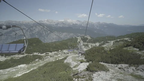 Overhead cable car moving to the top of mountain over the beautiful landscapes Stock Footage 85965302