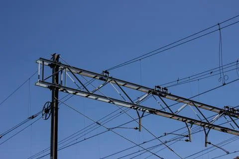 Overhead cable/catenary train on a blue sky Stock Photos