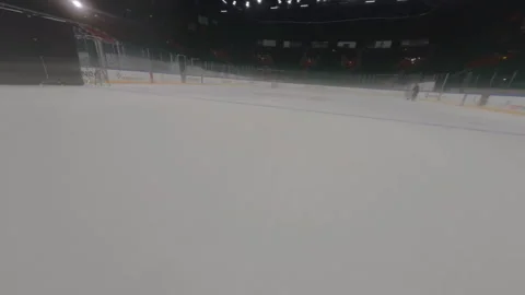 Overhead camera captures nearly empty stands at ice arena Stock Footage 303278624