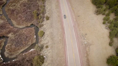Overhead car driving through interesting Southwest landscape Stock Footage 194181478