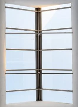 Overhead ceiling abstract with a view of the sky creates a surreal window vis Stock Photos