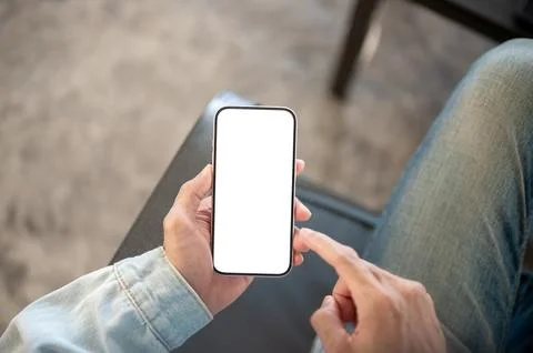 Overhead close up of empty blank white display screen smartphone in hand id.. Stockfoto's