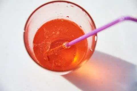 An overhead close-up shot of a refreshing orange spritz cocktail in a tall .. Stock Photos
