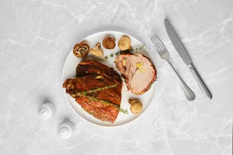 Overhead composition of roasted pork neck Foto stock