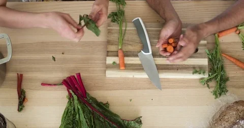 Overhead couple preparing artisinal dinner. Stock Footage 80298537
