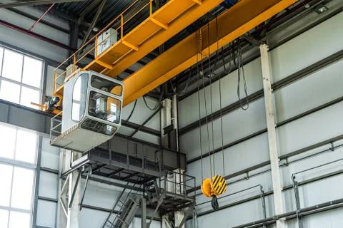 Overhead crane with hook in engineering plant shop Stock Photos