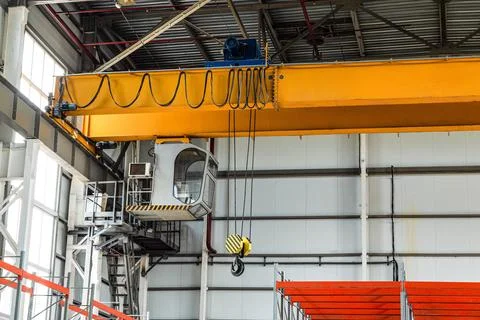 Overhead crane with hook in engineering plant shop Stock Photos