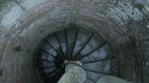 Overhead crane shot of medieval stone sprial staircase Stock Footage