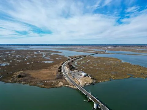 Overhead drone aerial view of a curved road with several bridges over sever.. Stock Photos
