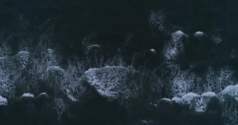 Overhead drone clip of the crushing waves on the beach in South of France Stock Footage 201062222