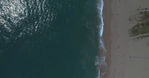 Overhead drone flight over little frequented beach Stock Footage 88105299