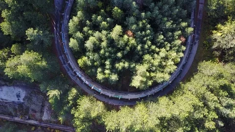 Overhead drone flight over neglected Olympic bobsleigh track Sarajevo Stock Footage 85399651