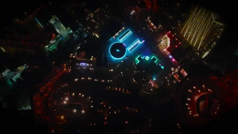 Overhead Drone Flight in Theme Park at Night with Neon Lights Stock Footage 166713322