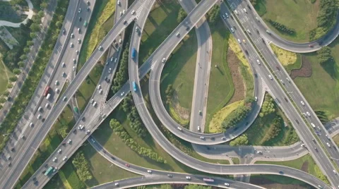Overhead drone shot of converging highways at busy city interchange China Stock Footage 67539131