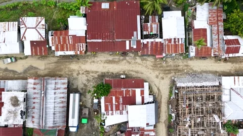 Overhead Drone Shot of Dirt Road Crossing in Remote Community Stock Footage 326093442