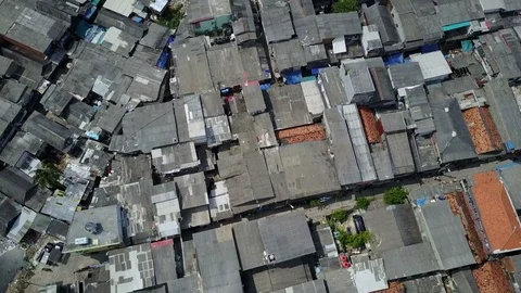 Overhead drone shot flying over rooftops of slums in Jakarta, Indonesia Video stock 78573949