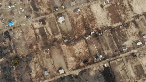 Overhead drone shot flying over rooftops of makeshift slums . Stock Footage 106327745