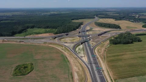 Overhead drone shot of highway interchange and fields Stock Footage 321773439