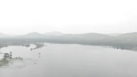 Overhead drone shot of a lake with small islands Stock Footage 302264647