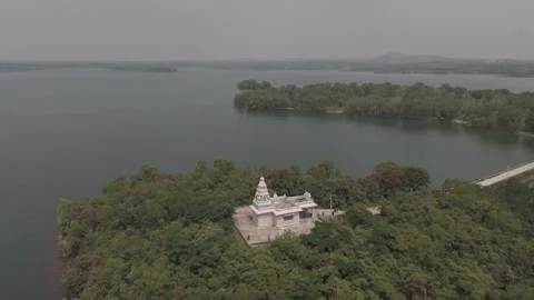 Overhead drone shot of a lake with small island Stock Footage 302265340