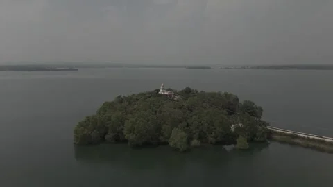 Overhead drone shot of a lake with small islands Stock Footage 302265462