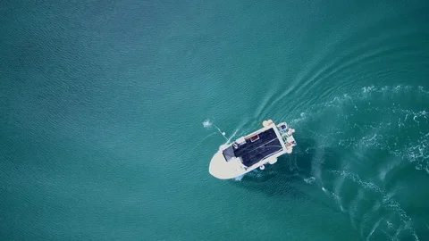 Overhead drone shot of line hook being thrown from creel fishing boat. 4K Stock Footage 93451811