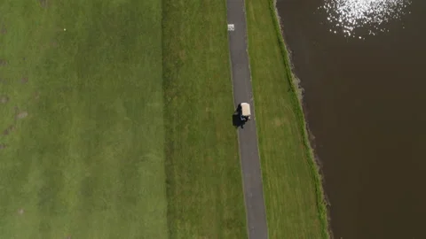 Overhead drone shot moving with golf cart 스톡 동영상 153689153