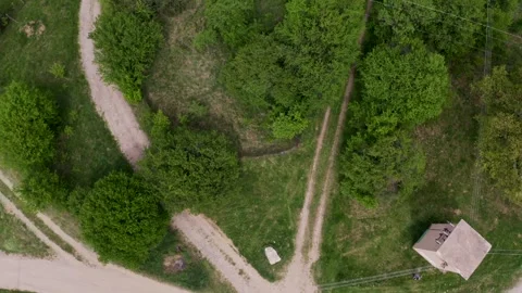 Overhead drone shot moving up over the village of Tsarichina Hole, a Stock Footage 265989956