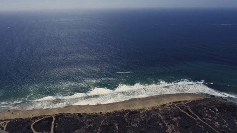 Overhead drone shot of the ocean waves crashing Stock Footage 84580046