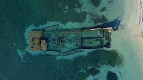 Overhead drone shot of a ship wrecked barge Stockbeeldmateriaal 224188166