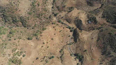 Overhead drone shot of small dried up river in mountain valley Ethiopia Stock-Footage 114386630