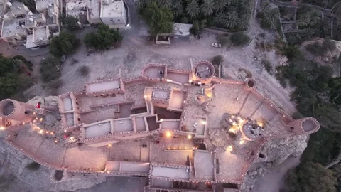 Overhead drone shot tracking out from Nakhal Fort Stock Footage 338238563