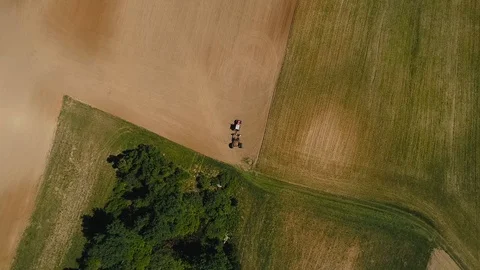 Overhead drone shot of tractor in a field. Stock Footage 90946283