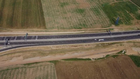 Overhead drone shot of vehicles on open highway Stock Footage 321773437