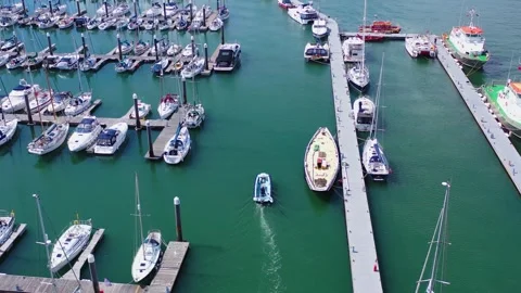 Overhead Drone Tracking Boat as It Approaches Harbour Mooring 4k Stock Footage 320946546