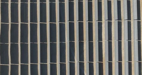 Overhead drone view and camera move pedestal up of a solar panel field. Stock Footage 273255479