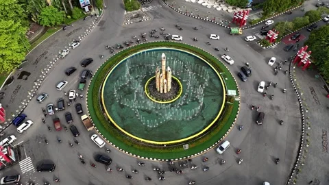 Overhead Drone View of Heavy Rush Hour Traffic at Tugu Digulis Roundabout Stock Footage 333498502