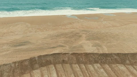 Overhead drone view of large sand barriers built along Newport Beach 스톡 동영상 347744860