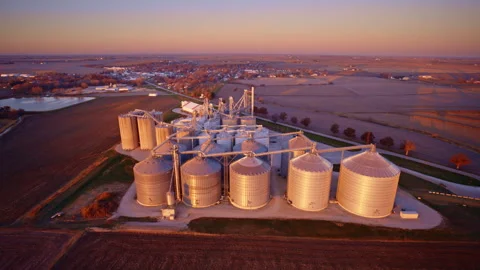 Overhead drone view of a massive grain elevator filled with storage silos Stock Footage 328777430