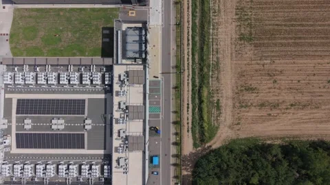 Overhead drone view moving backward above a data center rooftop, revealing Stock Footage 346105961