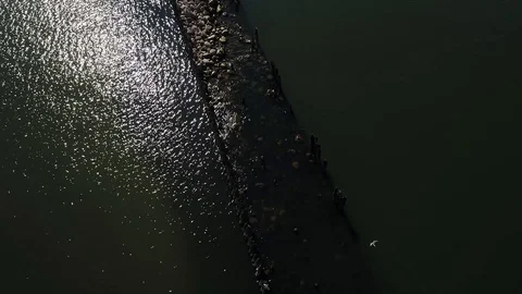 Overhead drone view of an old mole made from wood and stones Stock Footage 105295329