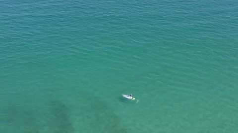 Overhead drone view of one white sailing boat in turquoise sea Stock Footage 159133525