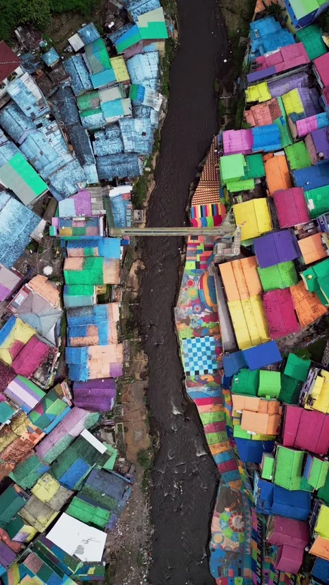 Overhead Drone View of Painted Urban Housing and Pedestrian Bridge Crossing Stock Footage 327781762