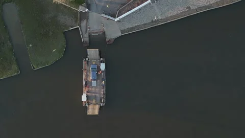 Overhead drone view of Reedham Ferry crossing River Yare with car #3 Stock Footage 290082668