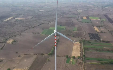 Overhead Drone View of Rural Wind Energy Turbine Set Against Patchwork Farming Vídeo Stock 342489165