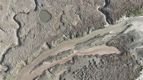 Overhead drone view of salt marshes wells next the sea Norfolk UK Stock Footage 305500216
